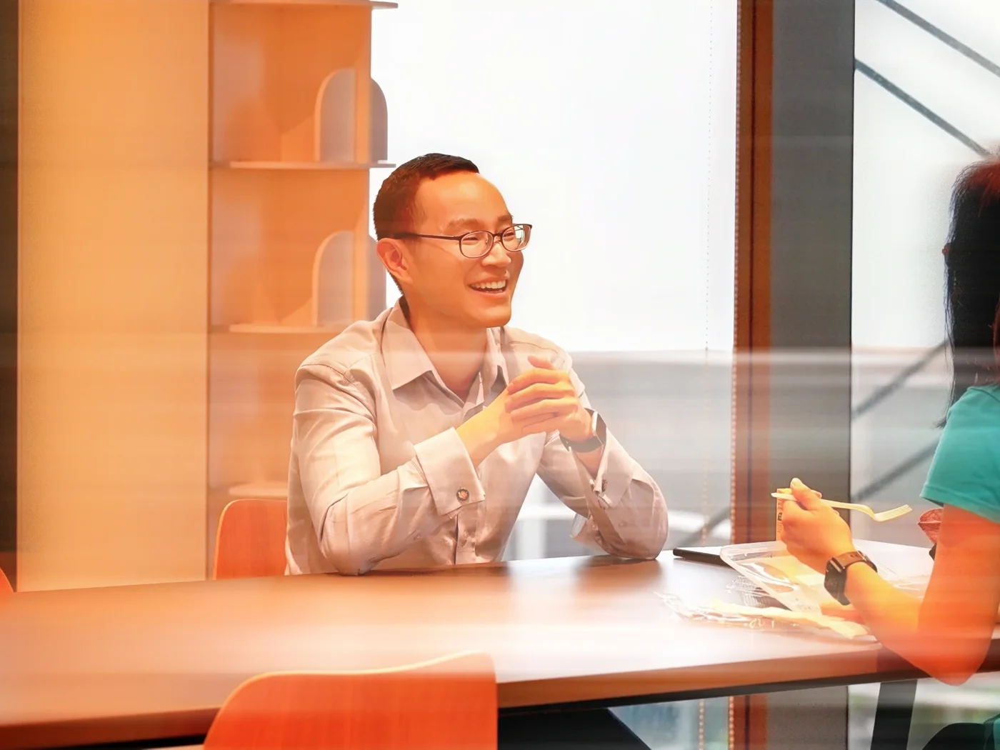 An Affinity advisor sharing a relaxed conversation with a client