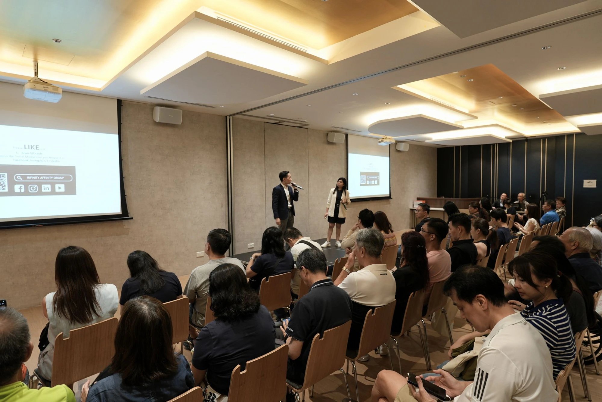 Affinity co-speakers presenting to a seminar audience